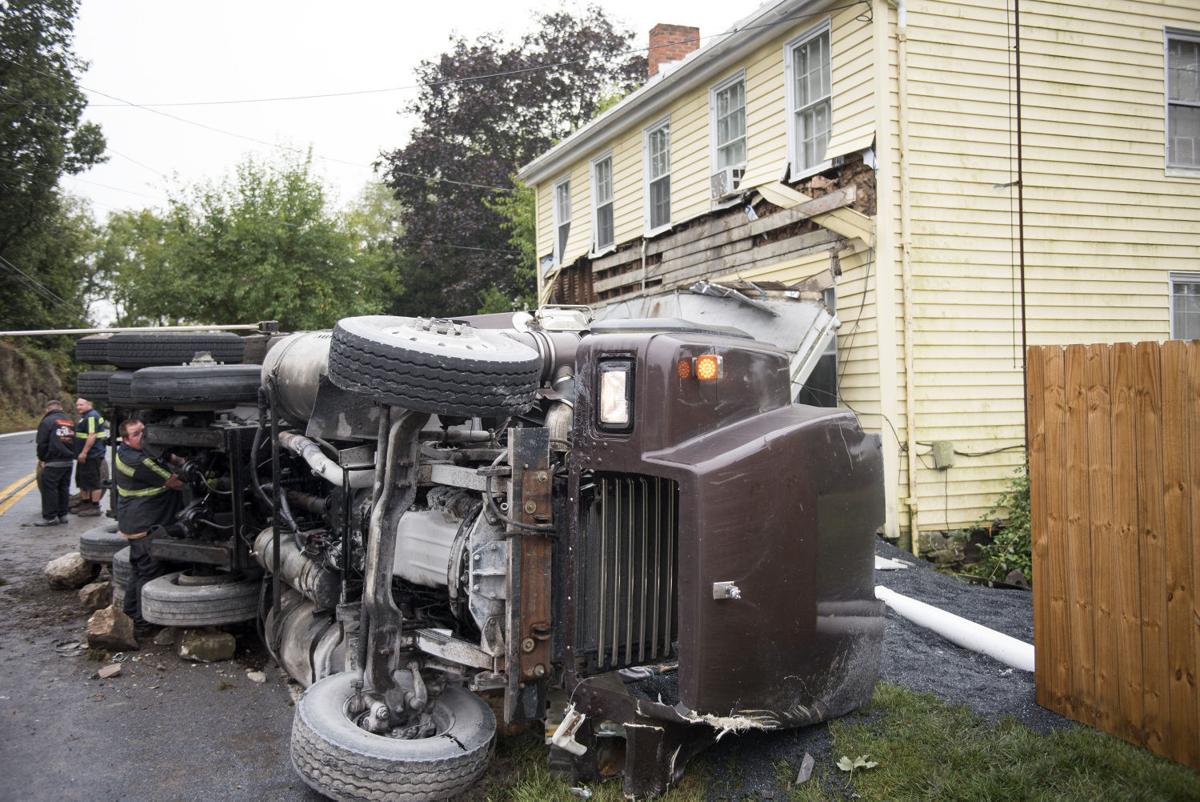 Dump truck overturns, strikes house off Md. 75 Disasters & accidents