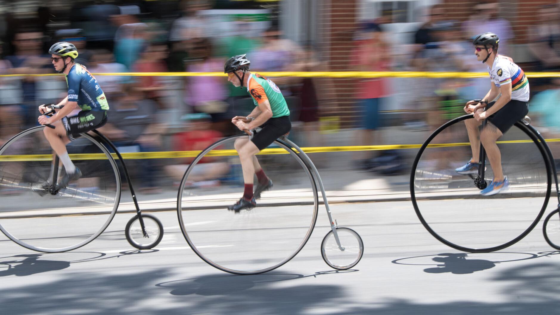 Thousands line downtown streets as high wheel racers fly past | Tourism ...