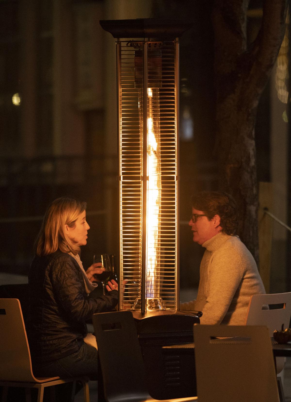Restaurants use patio heaters to offer outdoor dining in cold weather