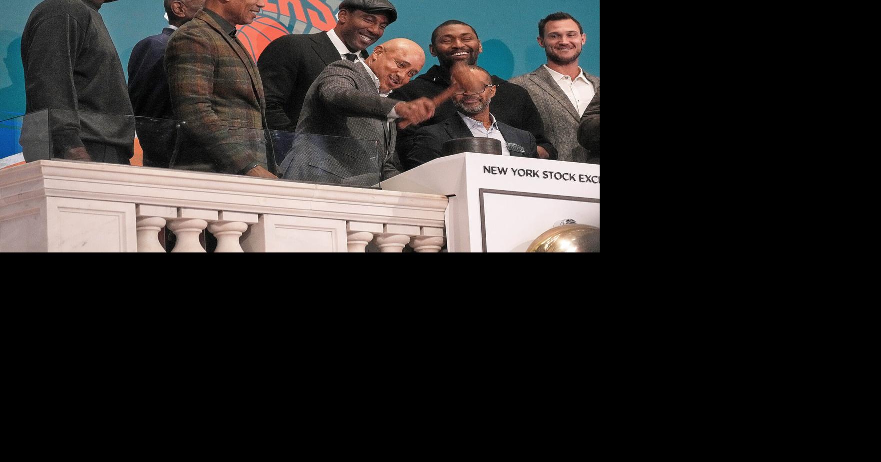 Stocks edge a bit below their latest records on Wall Street