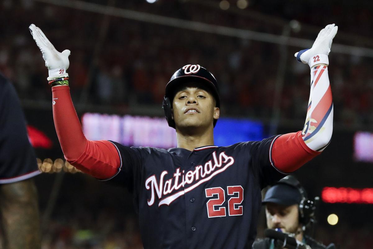 WASHINGTON, DC - SEPTEMBER 27: Washington Nationals right fielder Juan Soto  (22) picks up a handful of dirt to rub on his uniform prior to the New York  Mets versus the Washington