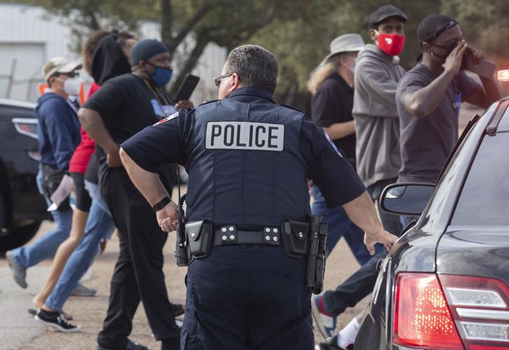 Marchers call for action after police shooting in La Marque Local