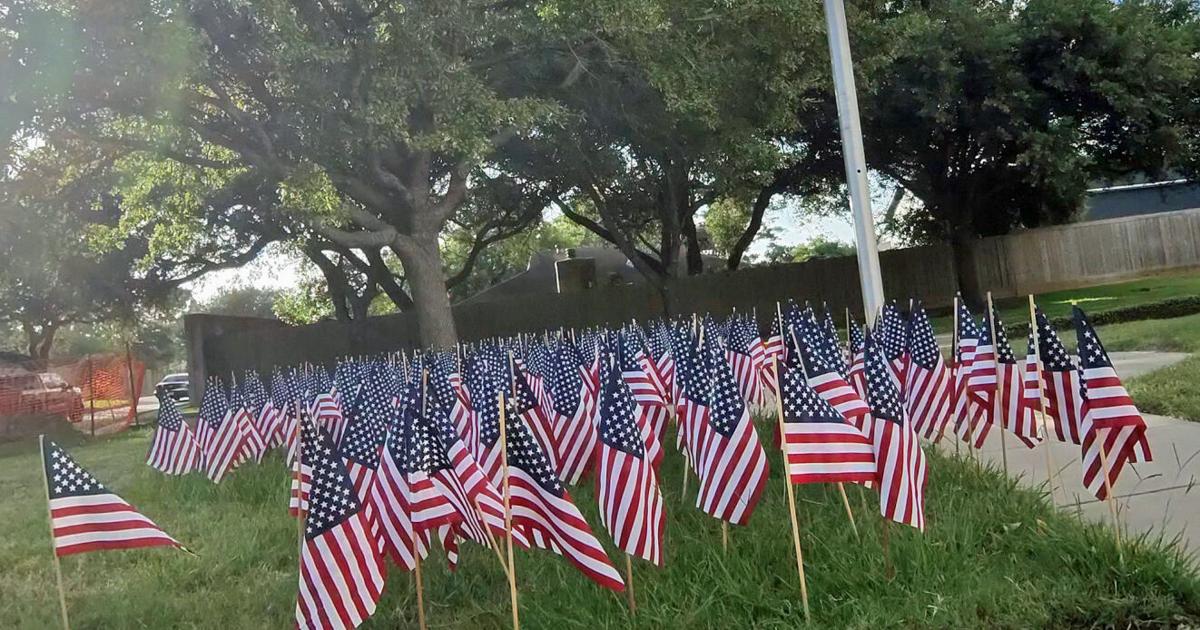 The lawn of fire station number 4 in League City covered with flags for the Fourth