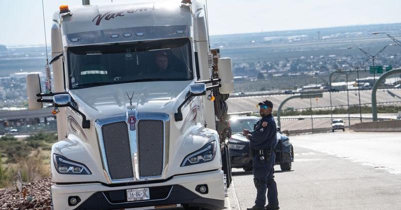 El Paso police commercial vehicle enforcement officers talk to a driver on Transmountain Road on Oct. 21 during increased inspections of commercial vehicles on the mountain highway.