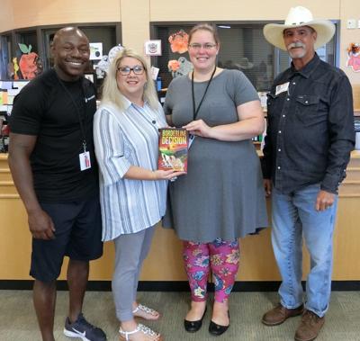 Texas City ISD library receives signed copy of book