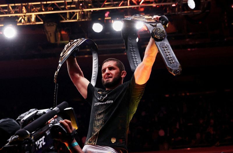 Islam Makhachev celebrates after defeating Jack Della Maddalena by ...