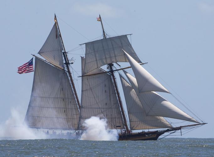 Hundreds gather on Galveston's seawall to view tall ships parade by