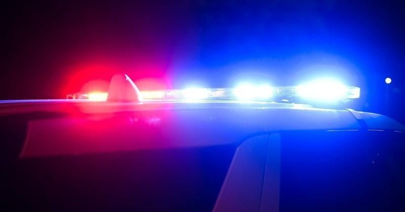 Police sirens are pictured from a distance.