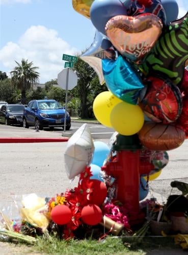 Flowers, balloons left for victims of fatal accident