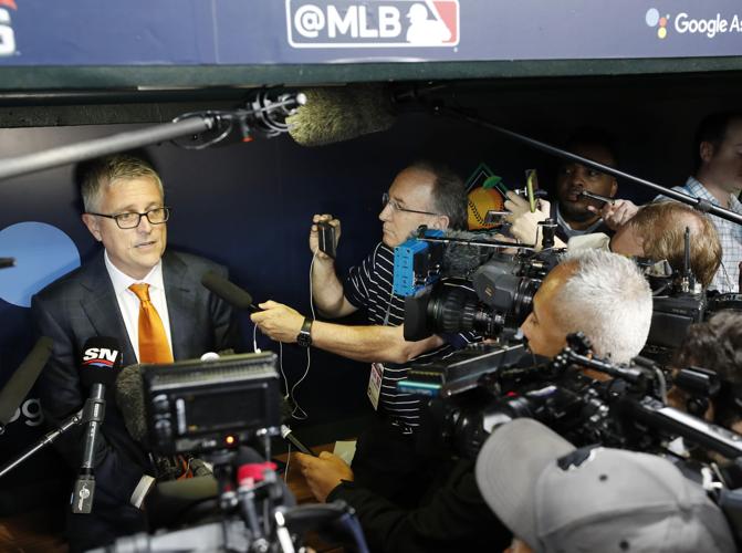 Houston Astros pitcher Brandon Backe answers a reporters question