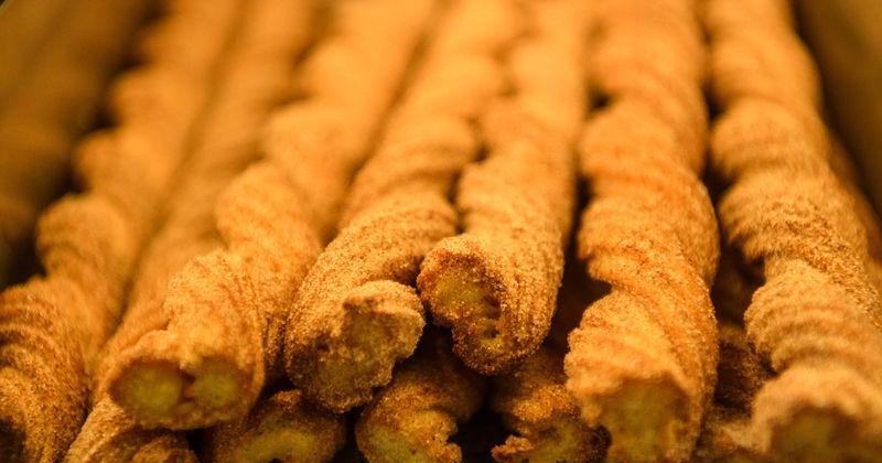 Churros are kept warm at the Costco food court during the store's grand opening ...