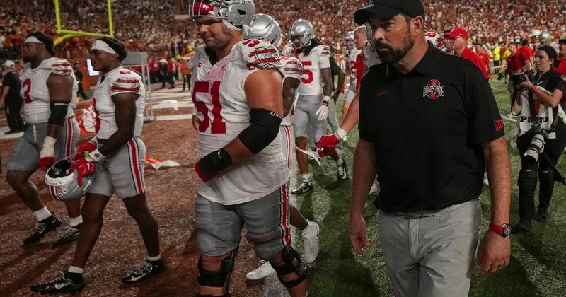 Ohio State Buckeyes head coach Ryan Day watches his players leave the field following the NCAA football game against the Texas Longhorns at Darrell K Royal–Texas Memorial Stadium in Austin, Texas on Sept. 12, 2026. Texas won 24-23.
