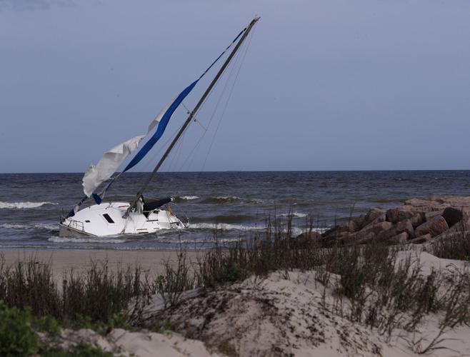 Shipwrecked sailboat still stuck near 10th Street