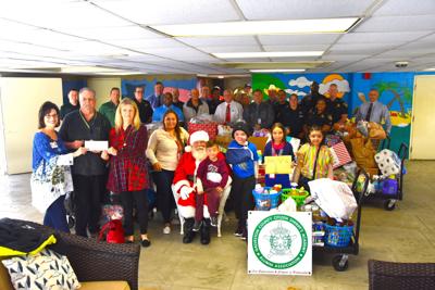 Deputy Claus brightens holidays for children