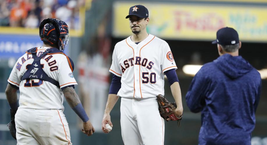 Houston Astros pitcher Brandon Backe answers a reporters question