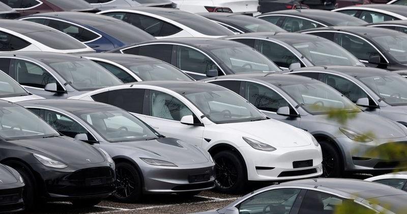 FILE PHOTO: Tesla electric vehicles are pictured at one of the company's delivery centers in Valenton, near Paris