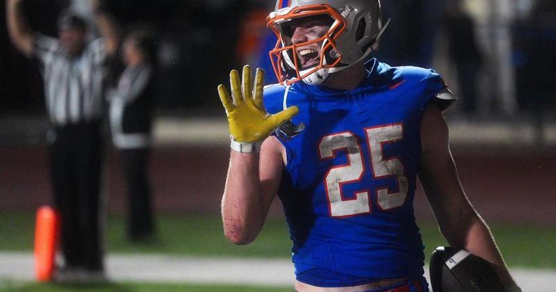 Bolles Bulldogs running back Xander Edwards (25) laughs after scoring his fifth touchdown in the third quarter.