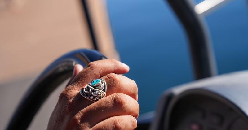 A silver-and-turquoise ring graces the hand of an employee at the Antelope Point Marina near Page, Arizona, on Oct. 7, 2026.