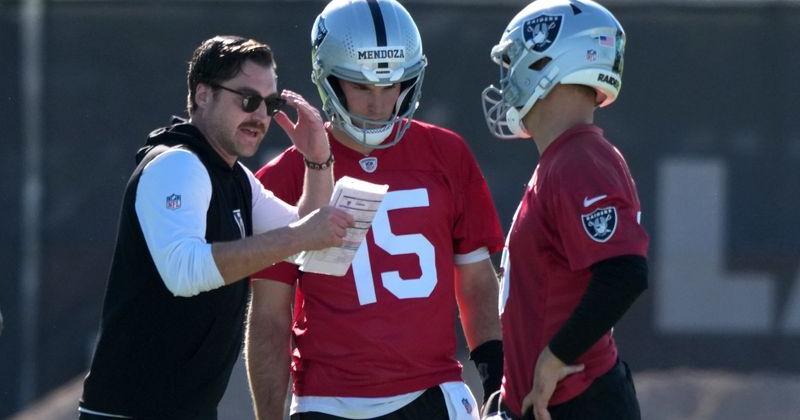 Las Vegas Raiders offensive coordinator Andrew Janocko (left) talks with quarterbacks Fernando Mendoza (15) and Kirk Cousins (8) during minicamp on June 9 at Intermountain Health Performance Center in Henderson, Nevada.
