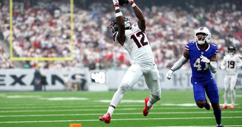 Sep 13, 2026; Houston, Texas, USA; Houston Texans wide receiver Nico Collins (12) makes a catch against Buffalo Bills cornerback Christian Benford (47) during the first quarter at Reliant Stadium. Mandatory Credit: Troy Taormina-Imagn Images