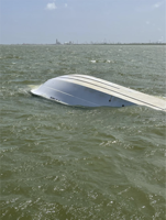 Coast Guard rescues four from sinking boat near Texas City Dike
