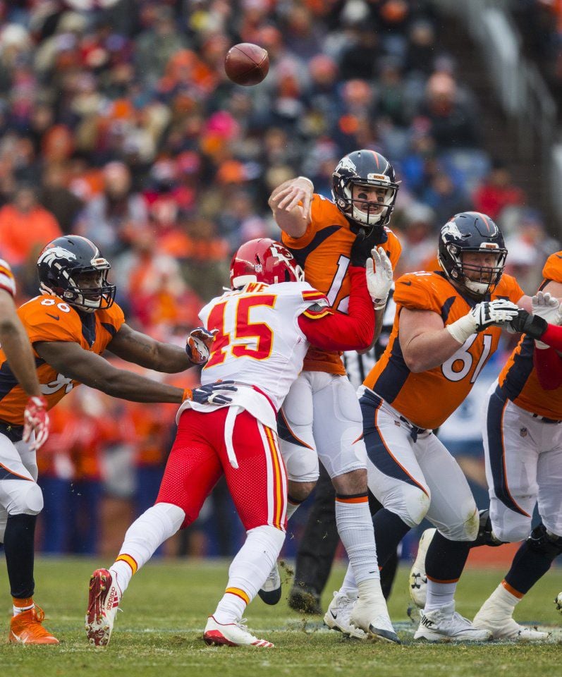 Chiefs inside linebacker Ukeme Eligwe hits Broncos quarterback Paxton Lynch as he throws during the first quarter Sunday, Dec. 31, 2017, at Sports Authority Field at Mile High in Denver. (The Gazette, Christian Murdock)