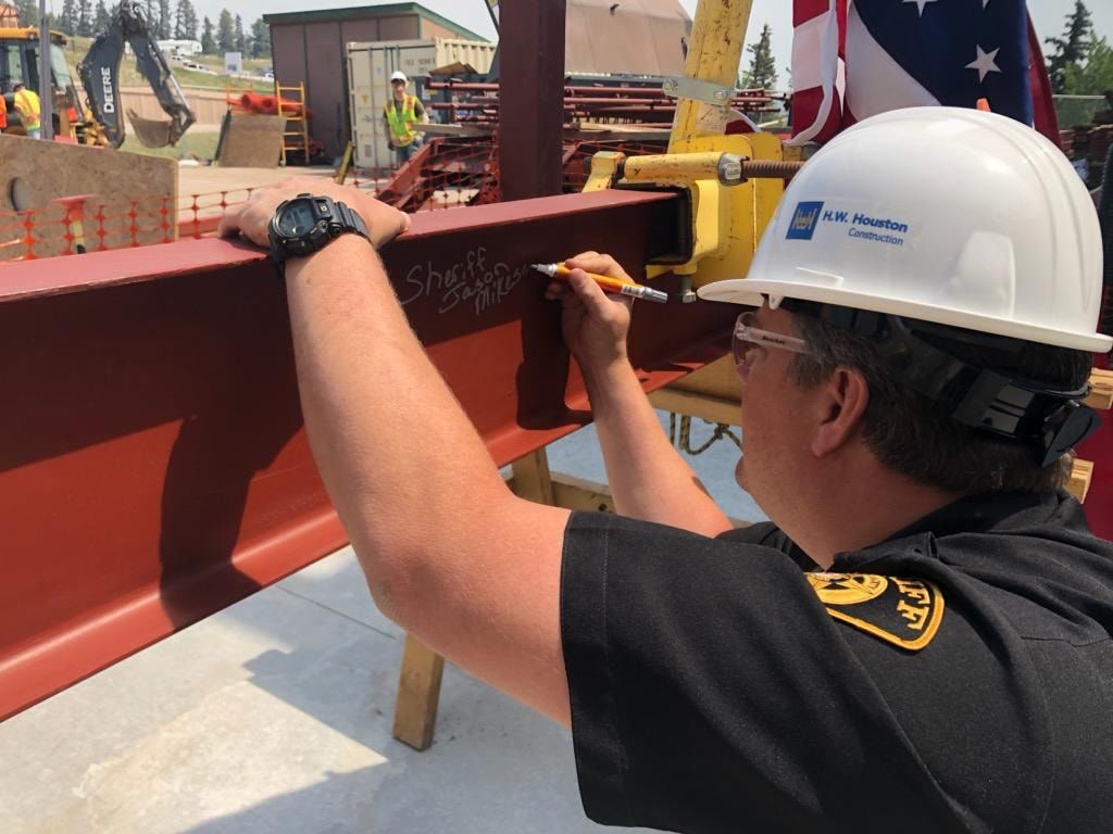 Teller sheriffs, county leaders celebrate new sheriff's office building with beam topping ceremony