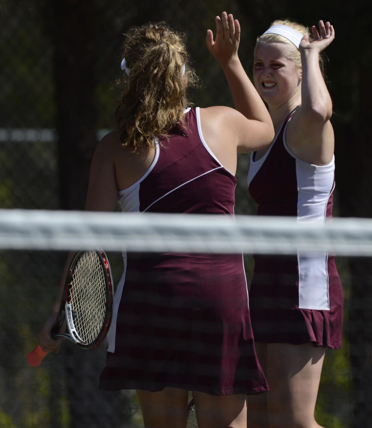 Cheyenne Mountian No. 2 doubles Tory Louis, right, and Claire Dibble celebrate after scoring a point against St. Mary's Academy in the finals Saturday, May 10, 2014, at the Colorado 4A girls state tennis championships finals at City Park in Pueblo. (The Gazette, Christian Murdock)