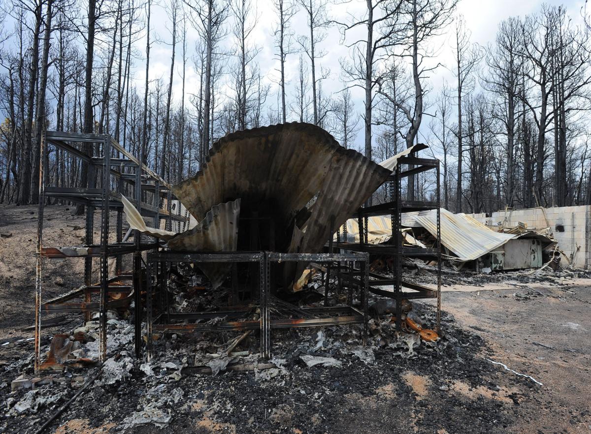 The workshop of Paul Vanslyke on Porcupine Ln. lays in ruins. Homeowners that are north of Burgess Rd. and east of Vollmer Rd. in the Black Forest burn area were able to return to their homes today on Tuesday, June 18, 2013.(Jerilee Bennett/The Gazette)