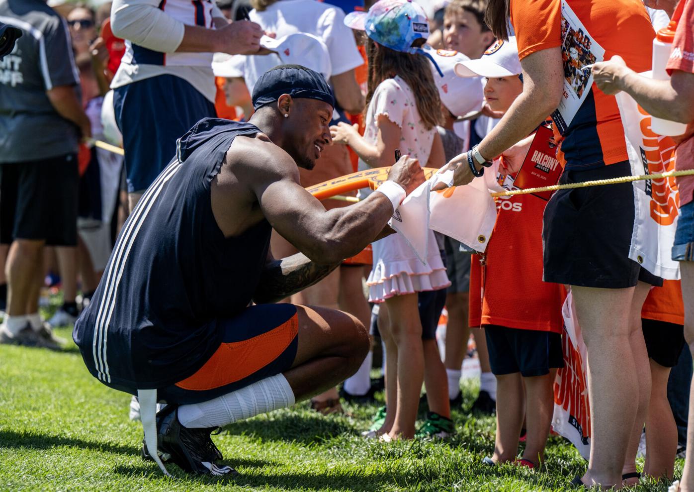 PHOTOS: Broncos fans admire team's new helmet and meet players at training  camp, Broncos