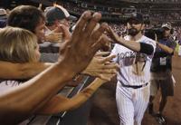 From left, retired Colorado Rockies first baseman Todd Helton is joined by  his daughter Gentry Grace, wife Christy and oldest daughter Tierney Faith  during a ceremony at which the player's number was