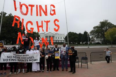FILE PHOTO: People protest for voting rights outside of the White House in Washington
