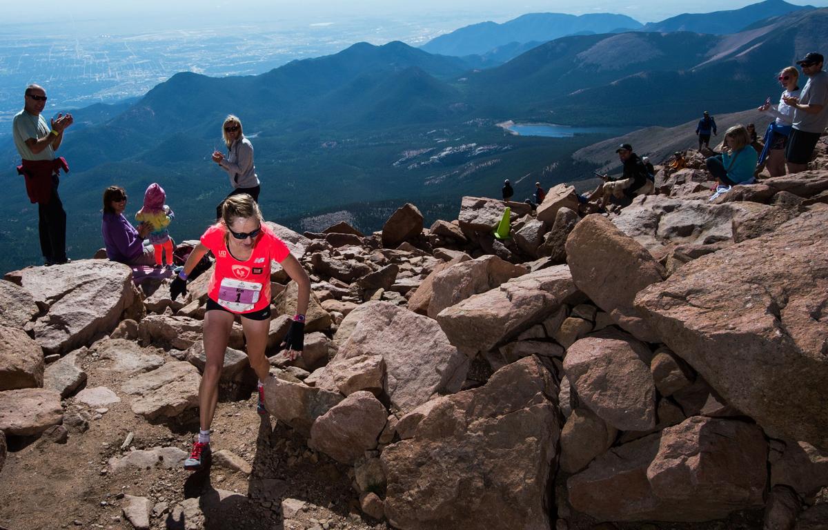 Kim Dobson of Eagle, Colo., rounds the final corner to win the women's race of the 2015 Pikes Peak Ascent Saturday, Aug. 15, 2015, on the top of 14,115-foot Pikes Peak. The 13.2-mile race begins in Manitou Springs and follows Barr Trail to the top of the mountain. (The Gazette, Christian Murdock)