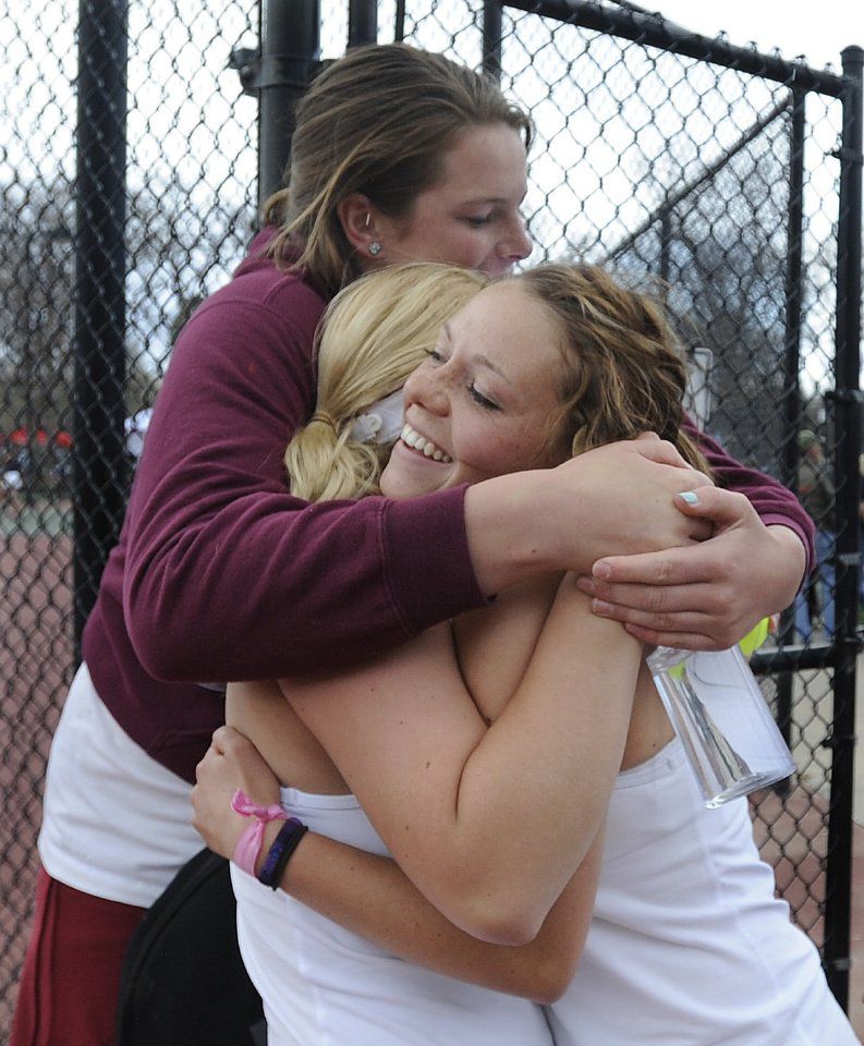 Cheyenne Mountain's Payton Fielding, Elizabeth Stegnaro and Caroline Fitzhugh celebrate after Stegnaro's win in state tennis action. It was the last match of the day for Cheyenne Mountain's girls tennis team and they won all seven of their semi-final matches at Colorado State 4A Girls Tennis in Pueblo, Colorado on Friday, May 10, 2013. Fielding plays #2 singles, Stegnaro plays #4 doubles and Fitzhugh plays #3 doubles. .(Jerilee Bennett/The Gazette)