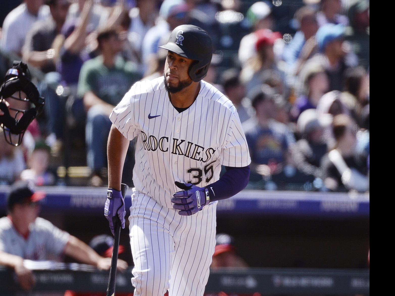 Elias Diaz of the Colorado Rockies celebrates with Brendan Rodgers