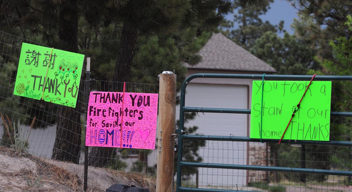 Sentiments praising firemen adorn the front gate of a home on Hardin Rd. on Tuesday, June 18, 2013. Homeowners that are north of Burgess Rd. and east of Vollmer Rd. in the Black Forest burn area were able to return to their homes today on Tuesday, June 18, 2013.(Jerilee Bennett/The Gazette)