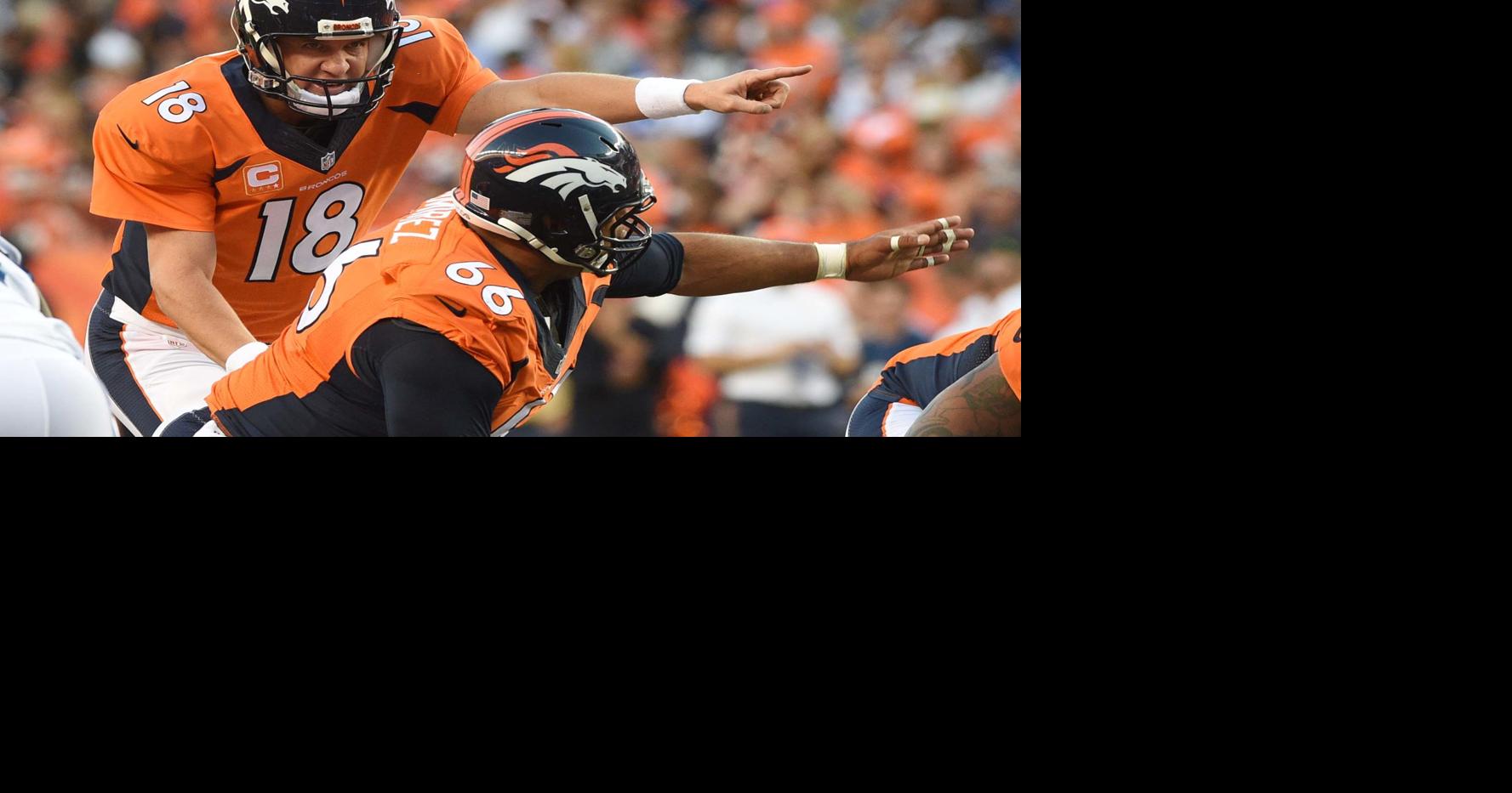 Broncos center Manny Ramirez takes direction from quarterback Peyton  Manning during the first quarter of a game against the Indianapolis Colts.  The Denver Broncos played the Indianapolis Colts in the season opener