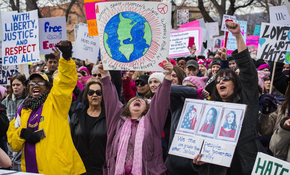 Rev. Tammy Garrett-Williams, left, Sharon River Hansen, and Sandra Walking Eagle cheer during a ralley in Acacia Park Saturday, Jan. 21, 2017, before the Colorado Springs Women's March in downtown Colorado Springs. The sister march of the Women's March on Washington, D.C., drew between 5,000 and 10,000 people. (The Gazette, Christian Murdock)
