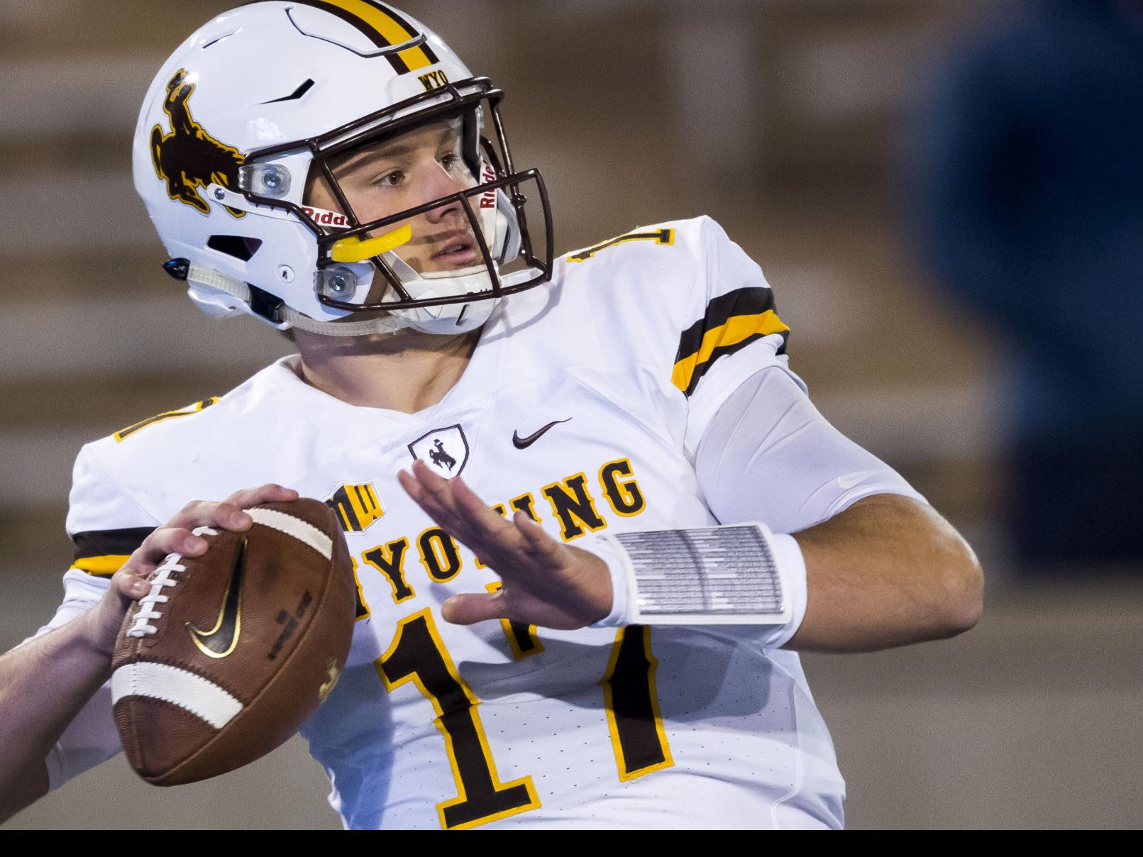 FILE – In this Oct. 22, 2016, file photo, Wyoming quarterback Josh Allen  reacts after scoring a touchdown in the second half of an NCAA college  football game against Nevada, in Reno