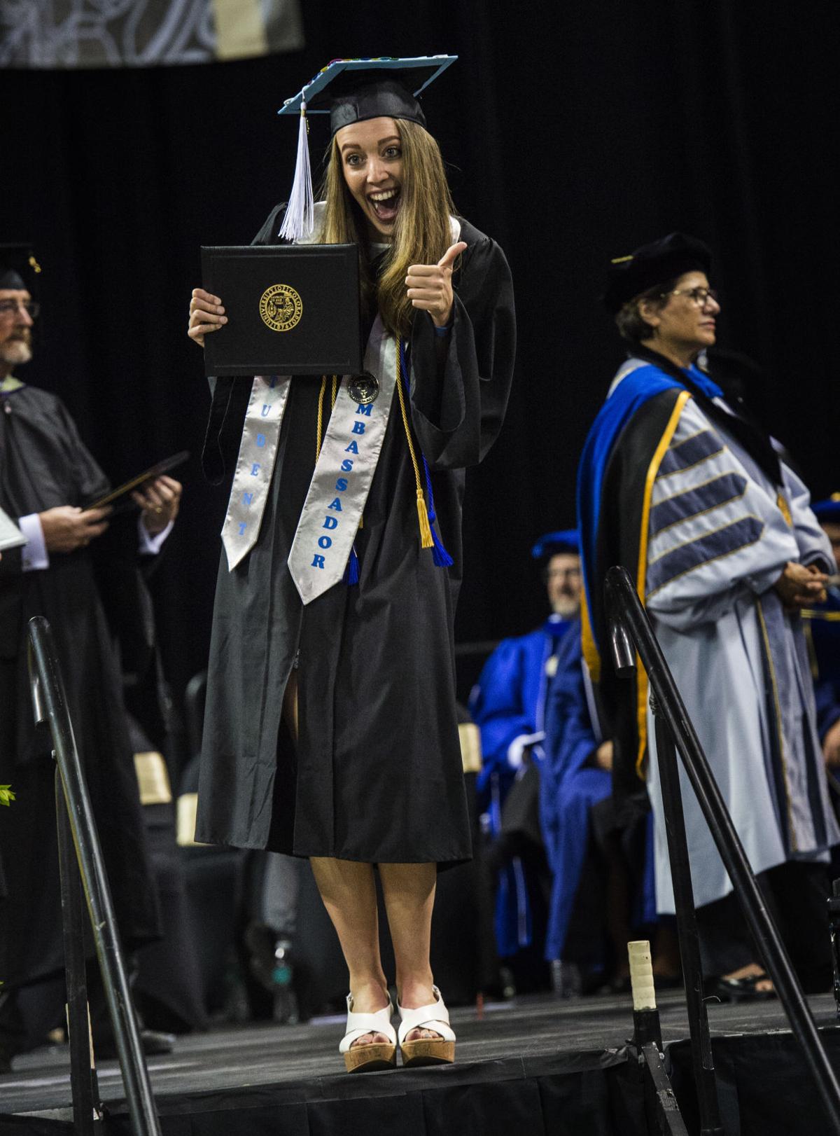 Kelsey Kuyper celebrates after receiving her diploma during the University of Colorado at Colorado Springs' morning commencement ceremonies Friday, May 12, 2017, at the Broadmoor World Arena in Colorado Springs. A record 1,532 students received their degrees this Spring. (The Gazette, Christian Murdock)