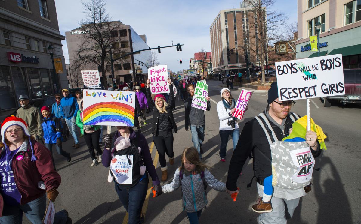Protesters march down Tejon Street Saturday, Jan. 21, 2017, during the Colorado Springs Women's March in downtown Colorado Springs. The sister march of the Women's March on Washington, D.C., drew between 5,000 and 10,000 people. (The Gazette, Christian Murdock)