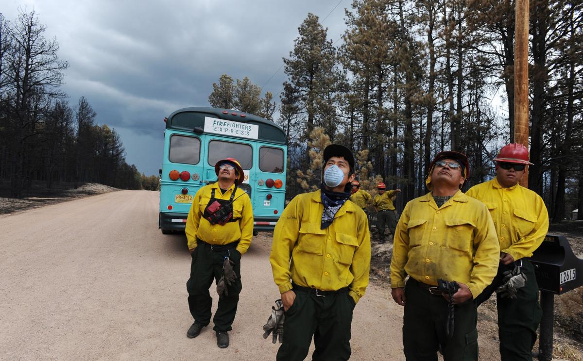 When thunderstorms threatened the Black Forest area, a group of firefighters from Ramah, New Mexico, take a break from knocking down hot spots along Porcupine Ln. to keep an eye on possible lightning danger. Homeowners that are north of Burgess Rd. and east of Vollmer Rd. in the Black Forest burn area were able to return to their homes today on Tuesday, June 18, 2013.(Jerilee Bennett/The Gazette)