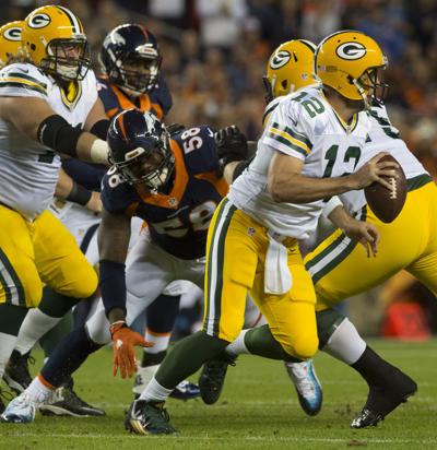 Denver outside linebacker Von Miller chases Green Bay quarterback Aaron Rodgers during the first quarter Sunday, Nov. 1, 2015, at Sports Authority Field at Mile High in Denver. (The Gazette, Christian Murdock)