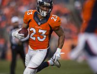 Broncos running back Devontae Booker watches the flyover before Denverâ€™s  game against Oakland Sunday, Jan. 1, 2017, at Sports Authority Field at  Mile High in Denver. (The Gazette, Christian Murdock), Sports