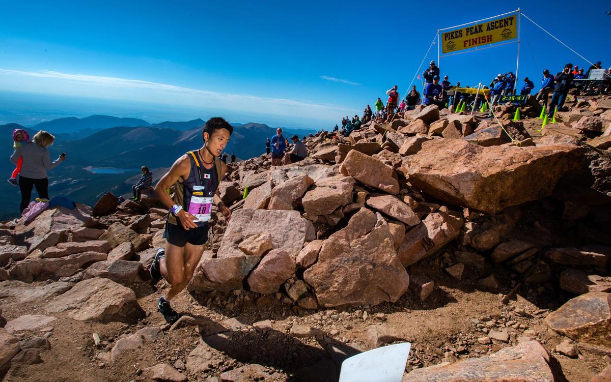 Touru Miyahara of Japan rounds the final corner to win the 2015 Pikes Peak Ascent Saturday, Aug. 15, 2015, on the top of 14,115-foot Pikes Peak. The 13.2-mile race begins in Manitou Springs and follows Barr Trail to the top of the mountain. (The Gazette, Christian Murdock)