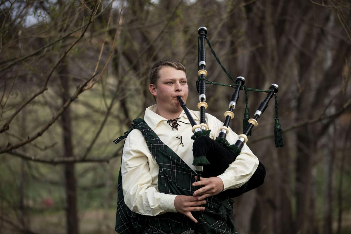Monument bagpiper plays music for solidarity
