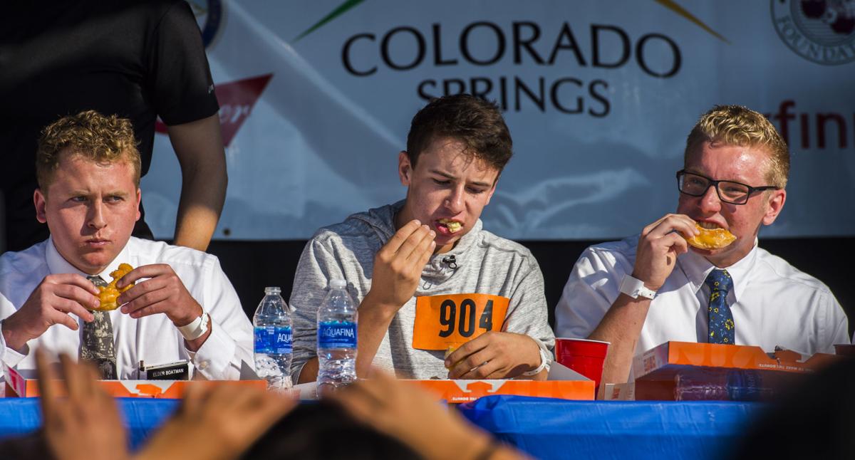 Contestants compete in the donut eating contest Saturday, Sept. 2, 2017, during the Colorado Springs Labor Day Lift Off in Memorial Park. The balloon festival runs through Monday morning. (The Gazette, Christian Murdock)