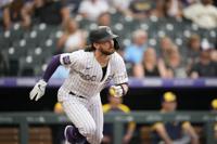 Rockies bash three homers, cruise past Marlins