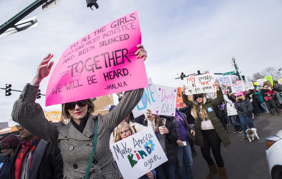 Protesters march down Tejon Street Saturday, Jan. 21, 2017, during the Colorado Springs Women's March in downtown Colorado Springs. The sister march of the Women's March on Washington, D.C., drew between 5,000 and 10,000 people. (The Gazette, Christian Murdock)