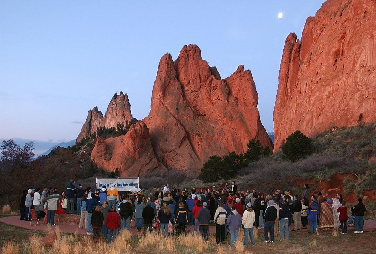 Approximately 150 people gather for the unofficial 84th annual Easter Sunrise Service at Garden of the Gods on Sunday, April 20, 2003. The service was officially canceled this year due to the cost of putting the event on. Most of the people who showed up this year were members of New Life Church. They gathered to worship through song and prayer. Photo by David Bitton